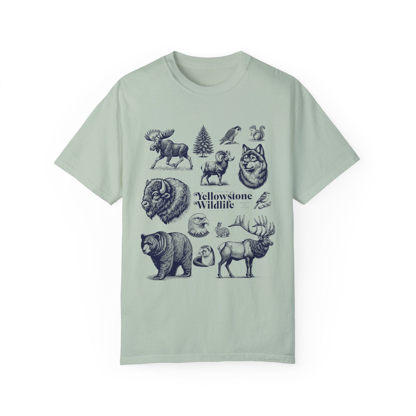 A soft garment-dyed t-shirt featuring vintage illustrations of Yellowstone wildlife including a bear, elk, wolf, and eagle.