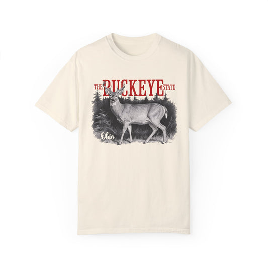 Graphic t-shirt featuring a detailed white-tailed deer illustration with bold “Buckeye State” and “Ohio” text, printed on a Comfort Colors tee.