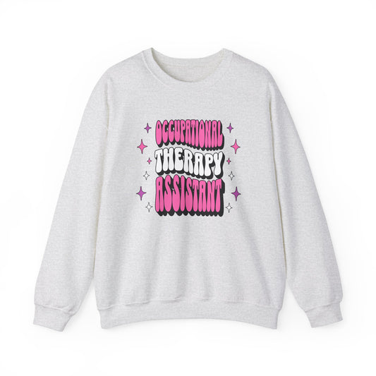 Groovy Pink Occupational Therapy Assistant Graphic Printed on an ash grey crewneck sweatshirt.