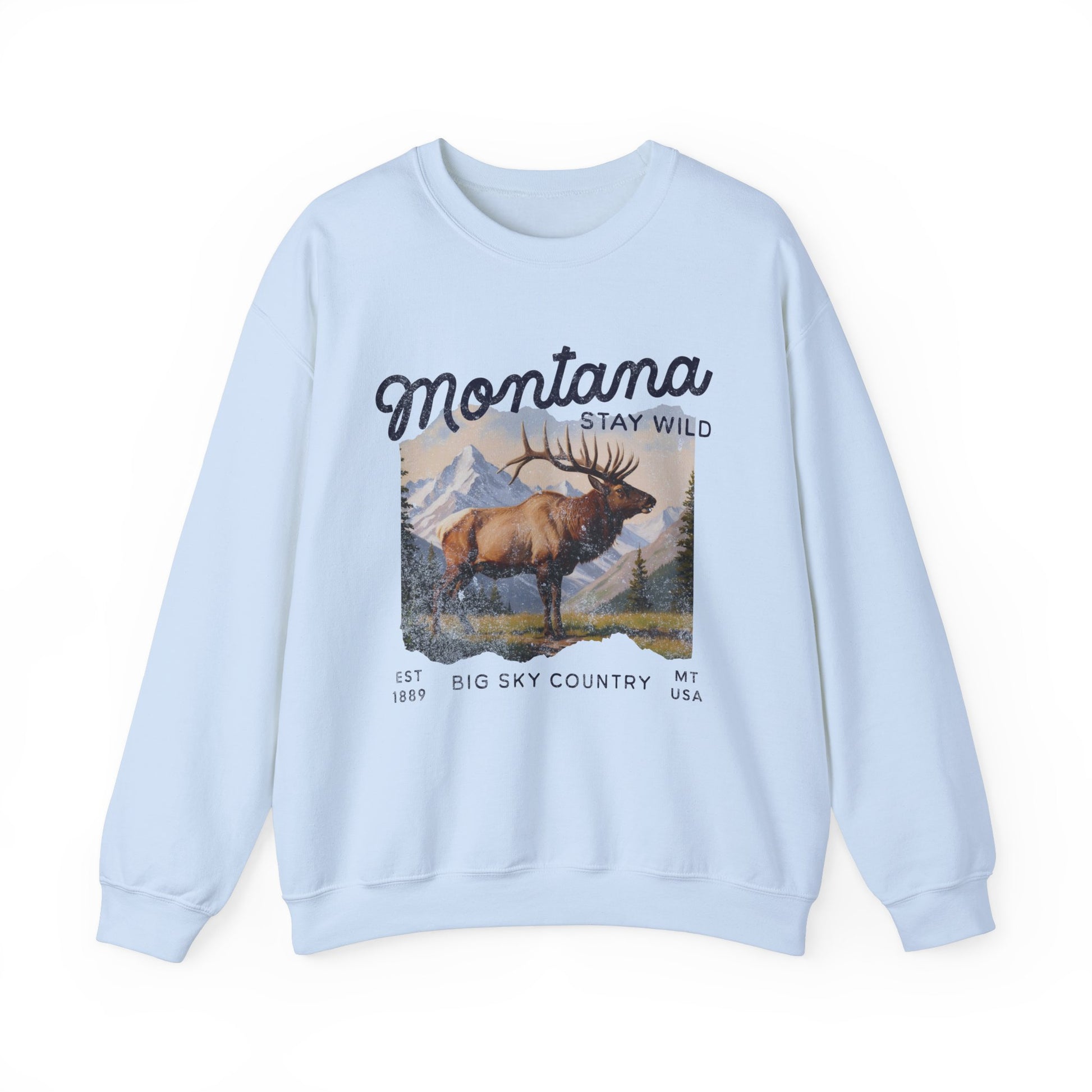 Vintage-style sweatshirt featuring a Montana elk graphic with mountain scenery and “Stay Wild” and “Big Sky Country” text.