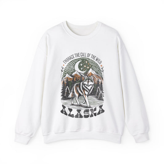 Alaska Wolf graphic sweatshirt featuring a howling wolf, pine trees, and mountain scenery with the phrase “Embrace the Call of the Wild.”