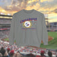 Grey Comfort Colors Crewneck Sweatshirt with a retro vintage inspired baseball character mascot. The text reads Cleveland Total Solar Eclipse CLE baseball April 2024