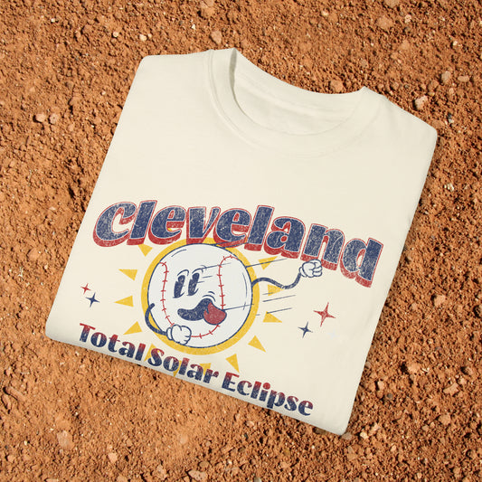 Comfort Colors t-shirt featuring a fun retro baseball mascot character with the text 'Cleveland Baseball Solar Eclipse April 2024.' Perfect for celebrating the upcoming solar eclipse in style while supporting Cleveland's baseball heritage.