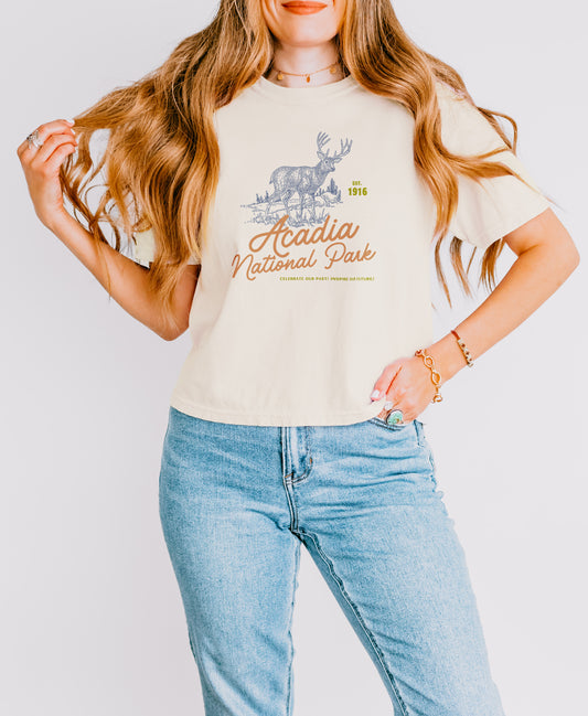 Model wearing Acadia National Park cropped t-shirt with moose and forest illustration – granola girl aesthetic Comfort Colors tee