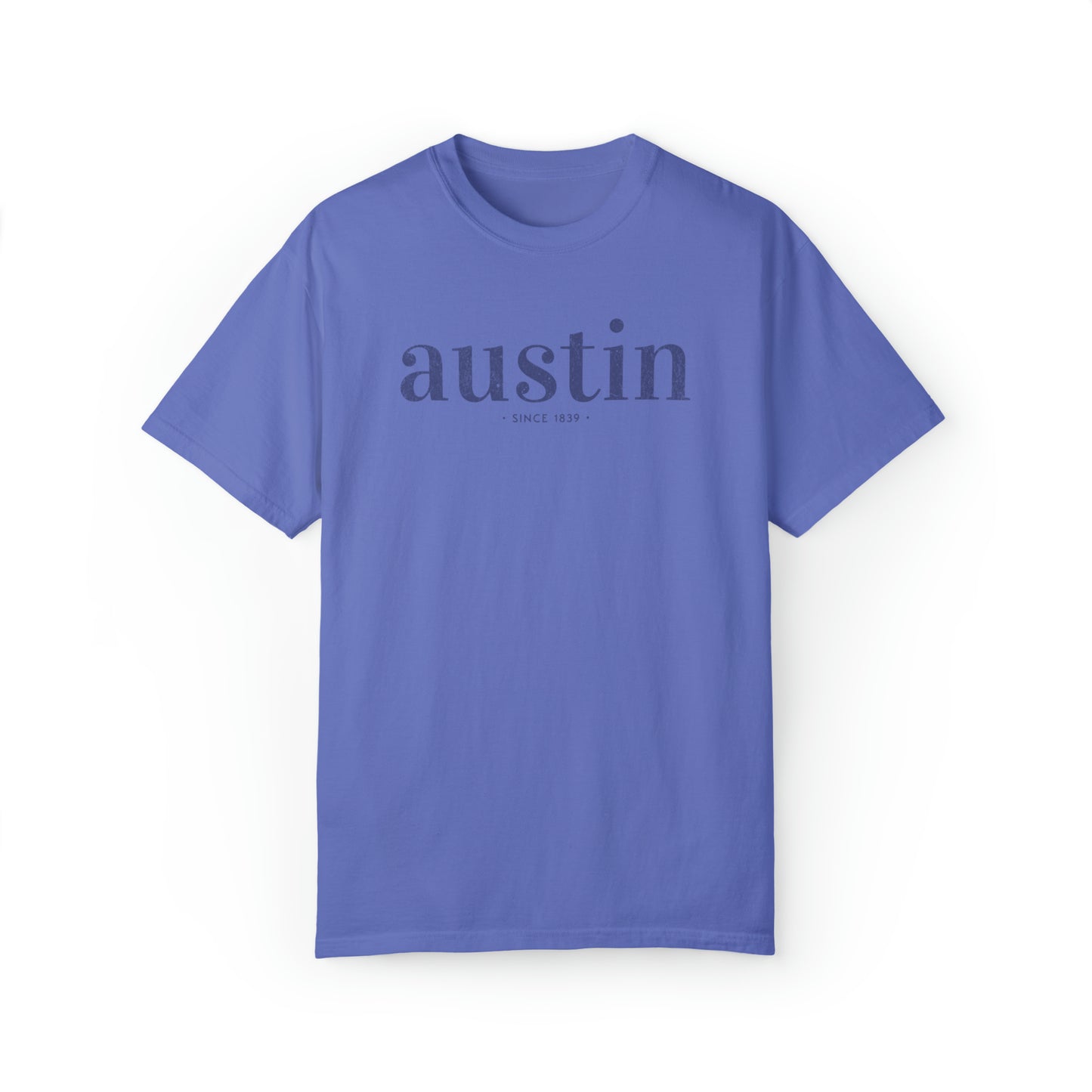 A Comfort Colors TShirt with a simple text graphic that reads austin since 1839 inspired by Austin, Texas