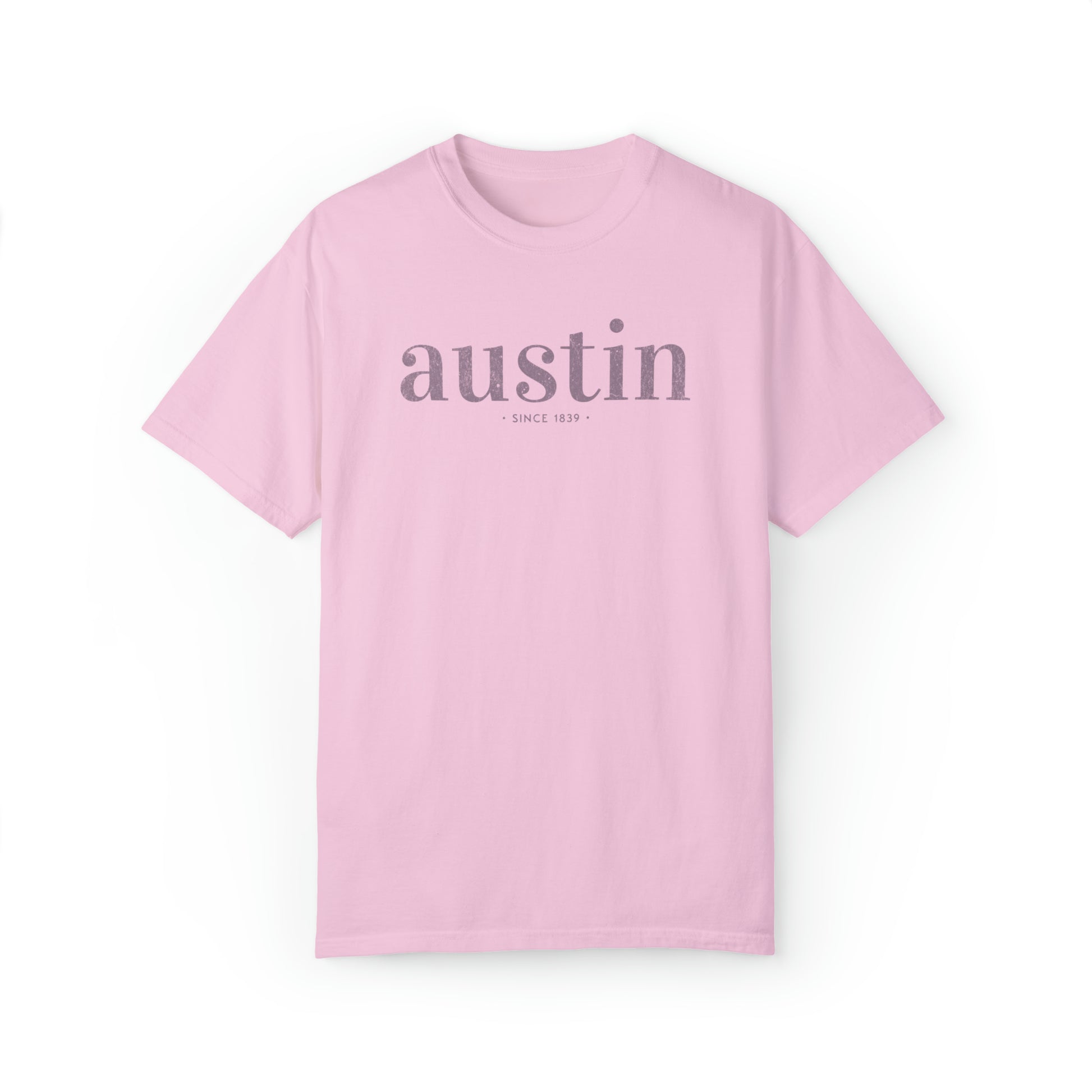 A Comfort Colors TShirt with a simple text graphic that reads austin since 1839 inspired by Austin, Texas