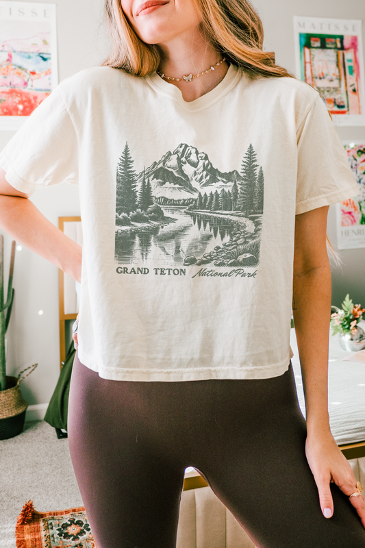 Vintage Inspired Mountain landscape graphic on a comfort colors boxy cropped tee that reads Grand Teton National Park